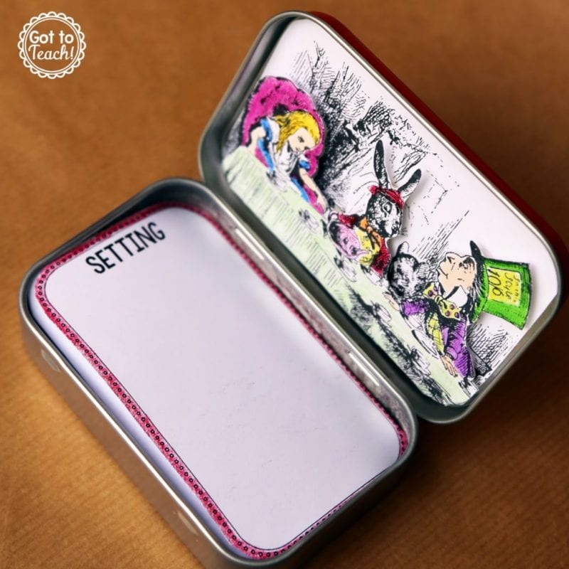 a mint tin with an drawing from Alice in Wonderland on the inside of this top and labeld notecards inside